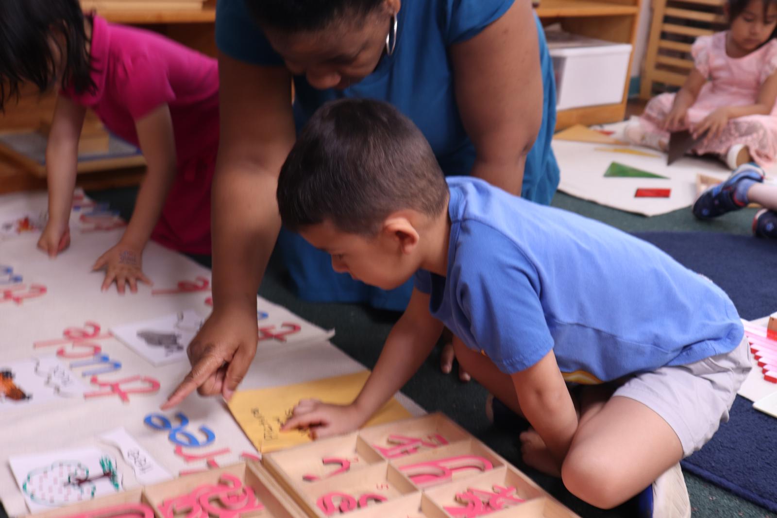 Children engaged in hands-on Montessori learning in Plano TX