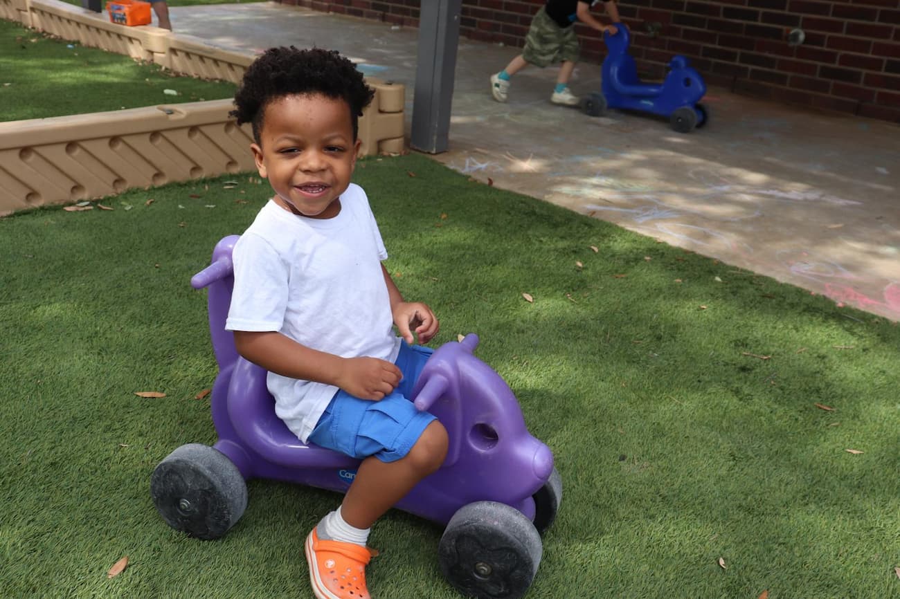 Group activities supporting social development in Plano childcare at Palm Grove