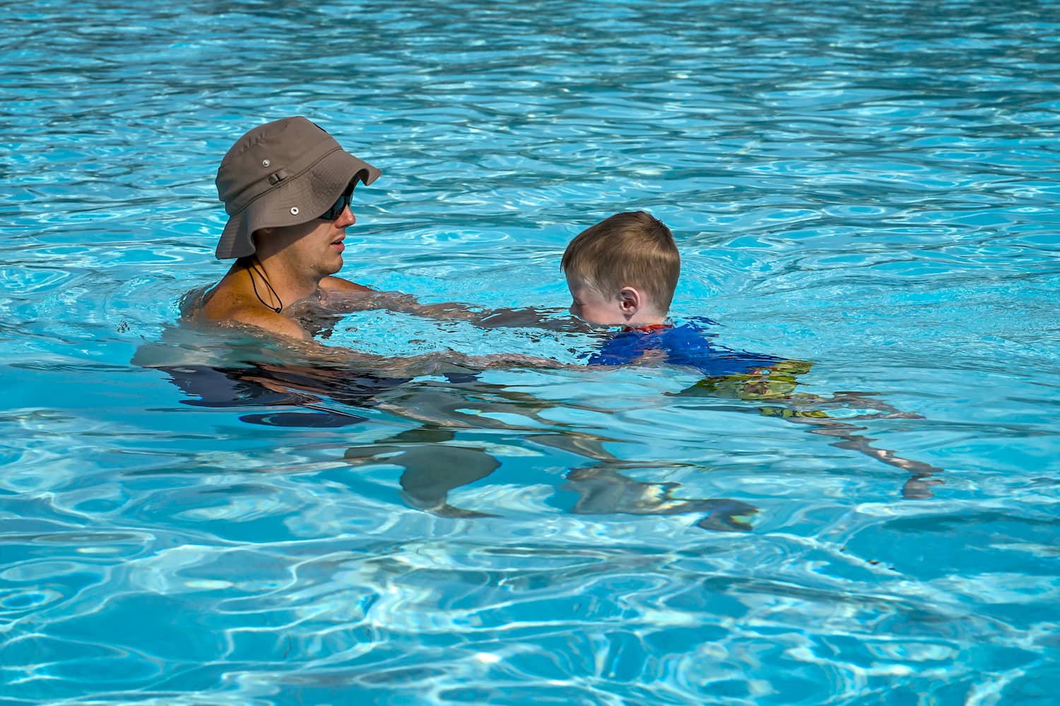 Summer camp Plano TX swimming and water safety at Palm Grove